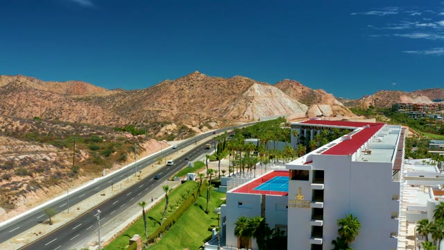 MARQUIS LOS CABOS MEXICO-2021: Vehicles Traveling on Highway with Mountainous Background