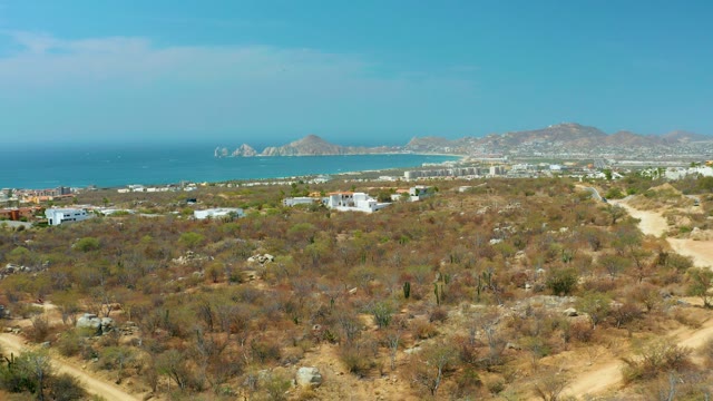CABO SAN LUCAS BCS MEXICO-2021: Coastal Desert Aerial with Distant Ocean and Buildings