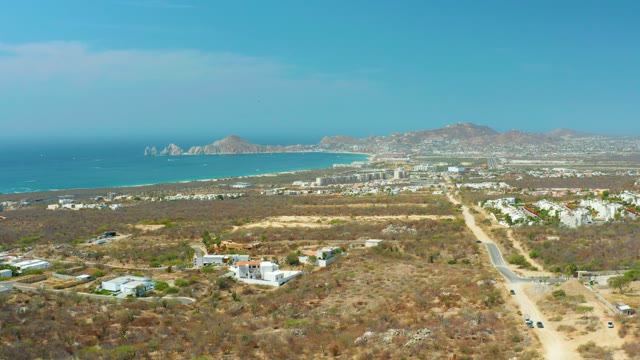 CABO SAN LUCAS BCS MEXICO-2021: Coastal Road and Buildings with Moving Vehicles