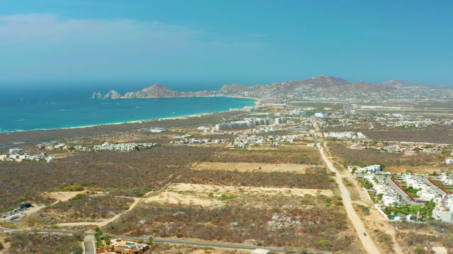 CABO SAN LUCAS BCS MEXICO-2021: Coastal Landscape with Beach, Buildings, and Dry Terrain