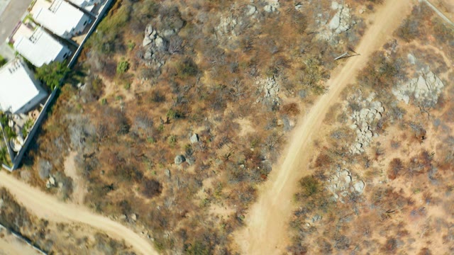 CABO SAN LUCAS BCS MEXICO-2021: Aerial Shift Over Arid Land and Structures