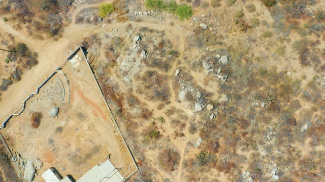 CABO SAN LUCAS BCS MEXICO-2021: Dry Terrain with Scattered Buildings and Vegetation