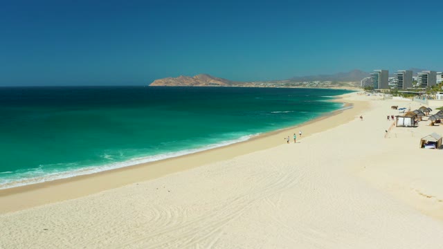 DREAMS LOS CABOS BCS MEXICO-2021: People Walking on a Sandy Beach with Turquoise Ocean