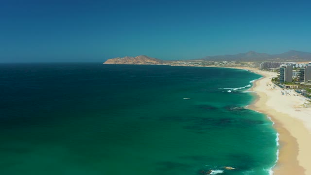 DREAMS LOS CABOS BCS MEXICO-2021: Waves Rolling Along Sandy Beach Coast