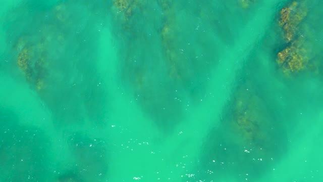DREAMS LOS CABOS BCS MEXICO-2021: Gentle Ripples on Turquoise Water over Submerged Rocks