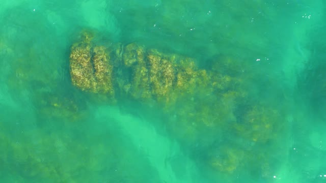 DREAMS LOS CABOS BCS MEXICO-2021: Underwater Rocks and Coral in Clear Turquoise Water