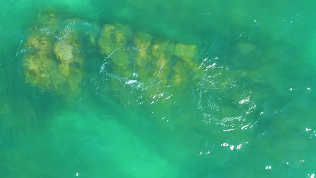 DREAMS LOS CABOS BCS MEXICO-2021: Rippling Clear Water over Submerged Rocky Outcrop