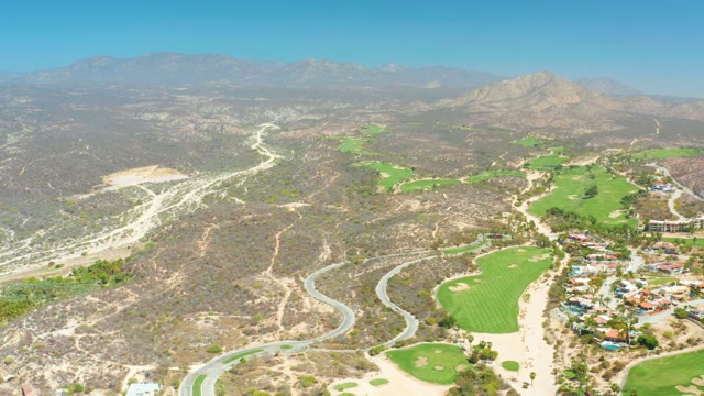 DREAMS LOS CABOS BCS MEXICO-2021: Winding Road and Golf Course in Hilly Terrain