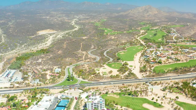 DREAMS LOS CABOS BCS MEXICO-2021: Highway Winding Through Golf Courses and Dry Hills