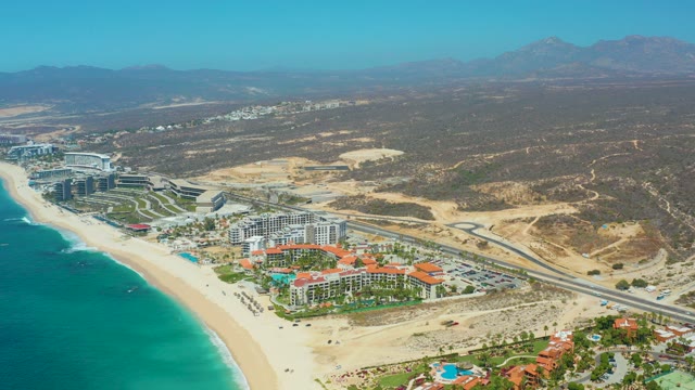 DREAMS LOS CABOS BCS MEXICO-2021: Coastal Resort with Moving Car and Beachgoer