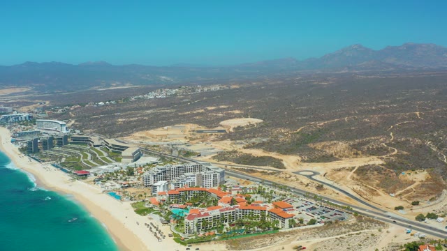 DREAMS LOS CABOS BCS MEXICO-2021: Coastal Road with Vehicle Moving Past Beach