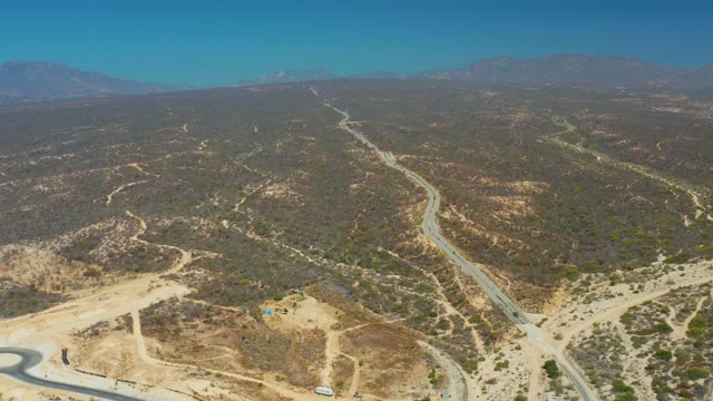 DREAMS LOS CABOS BCS MEXICO-2021: Vehicle Moving Along Winding Desert Road