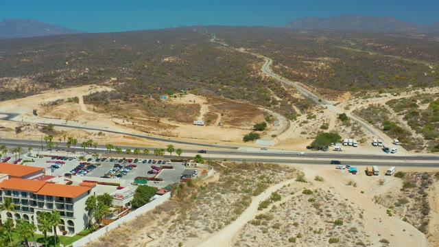 DREAMS LOS CABOS BCS MEXICO-2021: Arid Hillside Road with Moving Vehicles