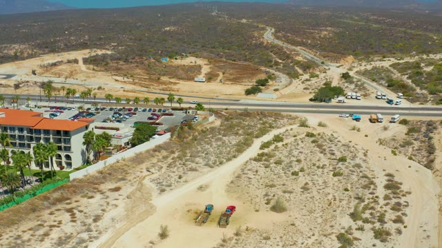 DREAMS LOS CABOS BCS MEXICO-2021: Sky Clouding Over Arid Hillside with Building and Road