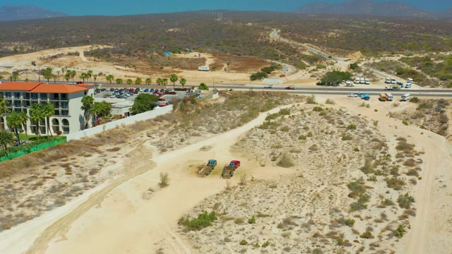 DREAMS LOS CABOS BCS MEXICO-2021: Desert Road with Moving Vehicles and Clearing Sky