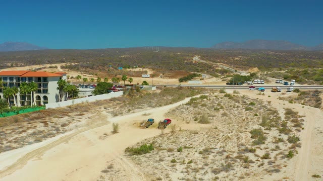 DREAMS LOS CABOS BCS MEXICO-2021: Desert Road with Moving Vehicles and Building