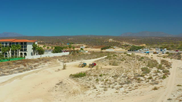 DREAMS LOS CABOS BCS MEXICO-2021: Vehicles Moving on a Desert Dirt Road