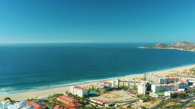 SAN JOSE DEL CABO BCS MEXICO-2021: Panning View of Beachfront Buildings and Ocean