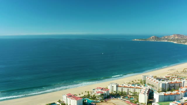 SAN JOSE DEL CABO BCS MEXICO-2021: Sandy Beach with Resort Buildings and Calm Ocean