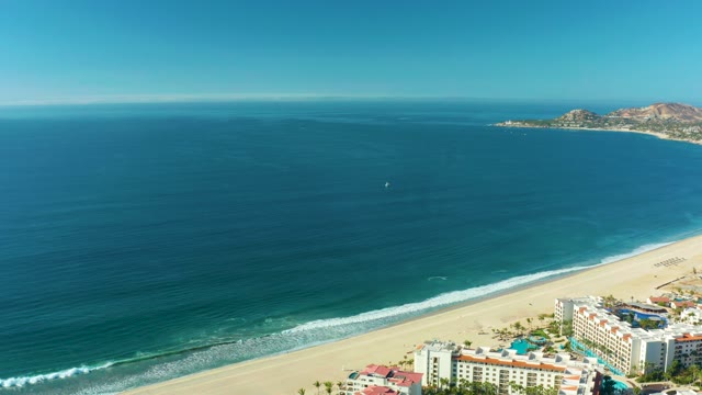 SAN JOSE DEL CABO BCS MEXICO-2021: Gentle Ocean Waves Rolling Onto Sandy Beach