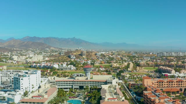 SAN JOSE DEL CABO BCS MEXICO-2021: City Buildings with Mountain Backdrop