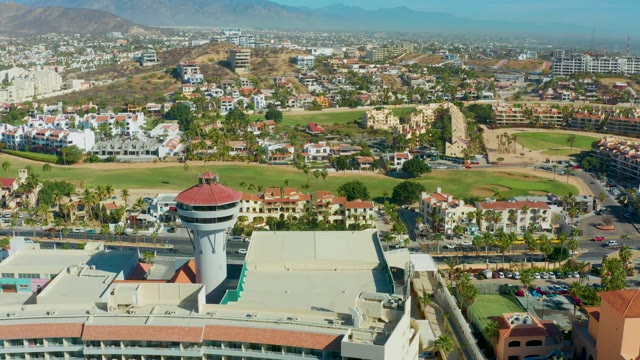 SAN JOSE DEL CABO BCS MEXICO-2021: Aerial Pan of City with Water Tower and Green Fields