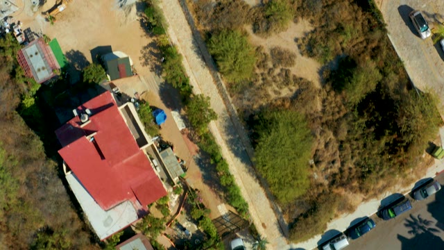 SAN JOSE DEL CABO BCS MEXICO-2021: Red-roofed Building to Open Field Aerial Transition