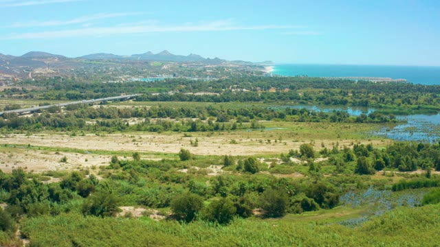 SAN JOSE DEL CABO BCS MEXICO-2021: Coastal Landscape with Fields, Road, and Ocean