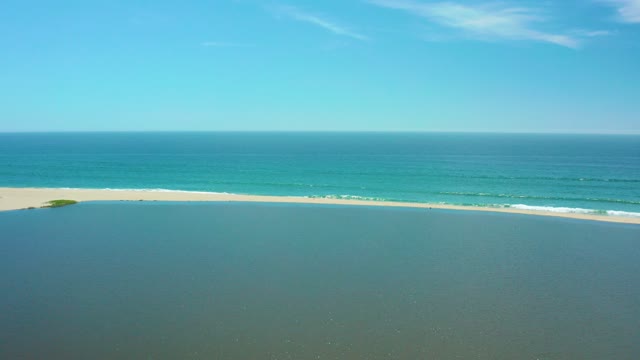SAN JOSE DEL CABO BCS MEXICO-2021: Lagoon and Ocean Waves at Sandy Shore