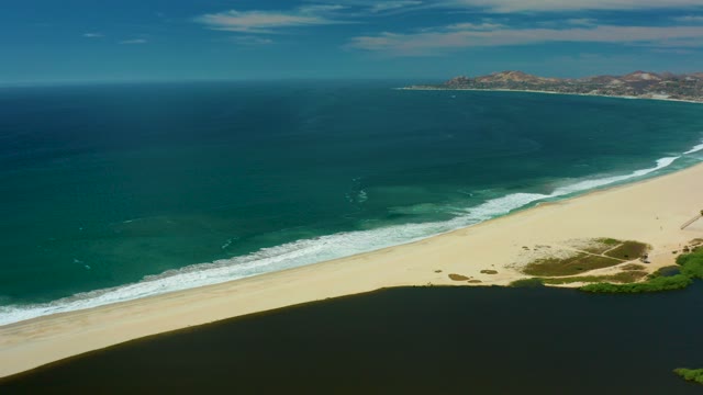 SAN JOSE DEL CABO BCS MEXICO-2021: Gentle Ocean Waves Along Sandy Shore