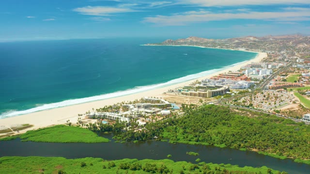 SAN JOSE DEL CABO BCS MEXICO-2021: Coastal Scene with Shifting Clouds and Ocean Waves