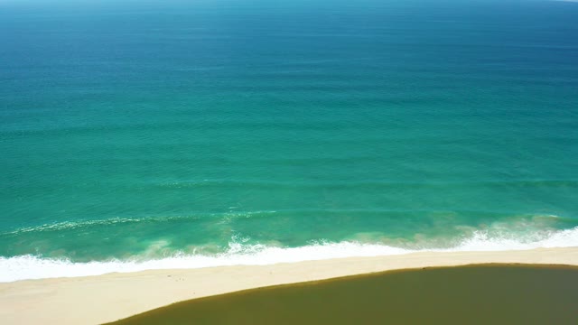 SAN JOSE DEL CABO BCS MEXICO-2021: Ocean Waves Rolling Toward Sandy Shore