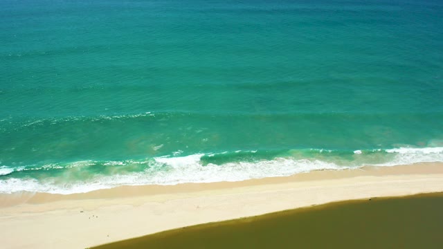 SAN JOSE DEL CABO BCS MEXICO-2021: Turquoise Waves Rolling Toward Sandy Shore
