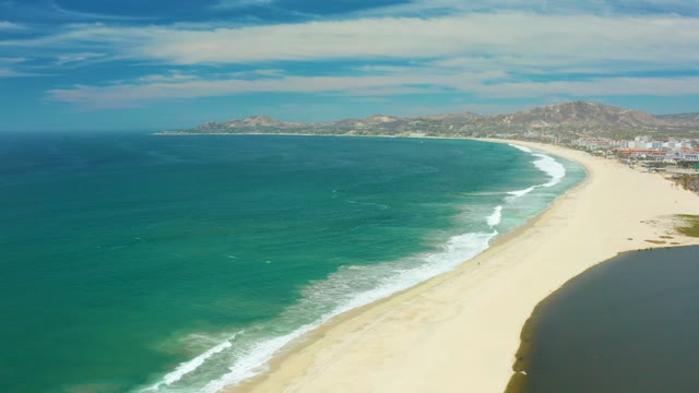 SAN JOSE DEL CABO BCS MEXICO-2021: Waves Rolling Onto a Sandy Coastal Shore