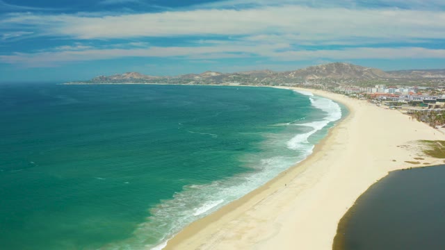 SAN JOSE DEL CABO BCS MEXICO-2021: Waves Rolling Onto a Sandy Beach