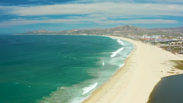 SAN JOSE DEL CABO BCS MEXICO-2021: Waves Rolling Onto Sandy Coastal Beach