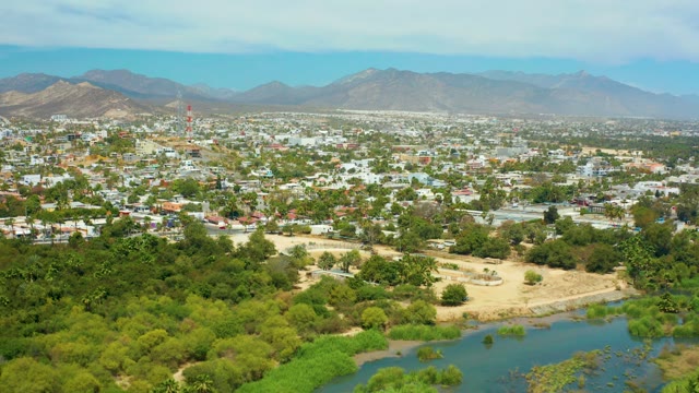 SAN JOSE DEL CABO BCS MEXICO-2021: Cityscape with River and Distant Mountains