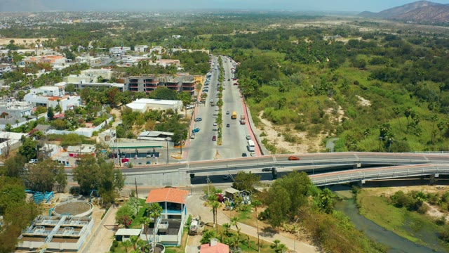 SAN JOSE DEL CABO BCS MEXICO-2021: Road Traffic Flowing Over Bridge and Canal