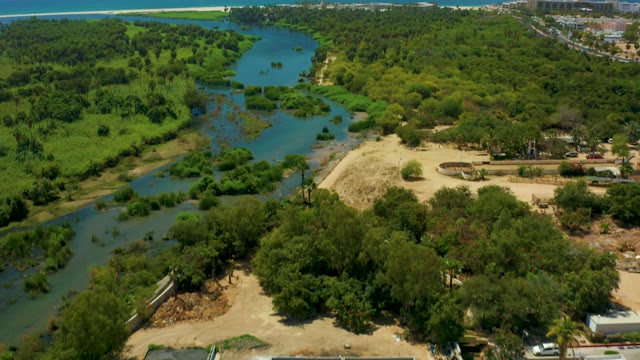 SAN JOSE DEL CABO BCS MEXICO-2021: River Meandering Through Lush Greenery to Ocean