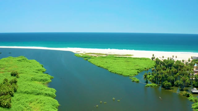 SAN JOSE DEL CABO ESTUARY BCS MEXICO-2021: River Flowing Into Ocean with Sandy Beach and Greenery