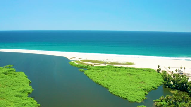 SAN JOSE DEL CABO ESTUARY BCS MEXICO-2021: Coastal River Flowing Into Ocean at Sandy Shore