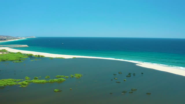 SAN JOSE DEL CABO ESTUARY BCS MEXICO-2021: Lagoon and Sandy Beach with Turquoise Ocean Waves