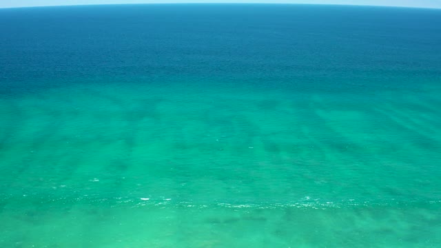 SAN JOSE DEL CABO ESTUARY BCS MEXICO-2021: Gentle Ocean Waves in Clear Turquoise Water