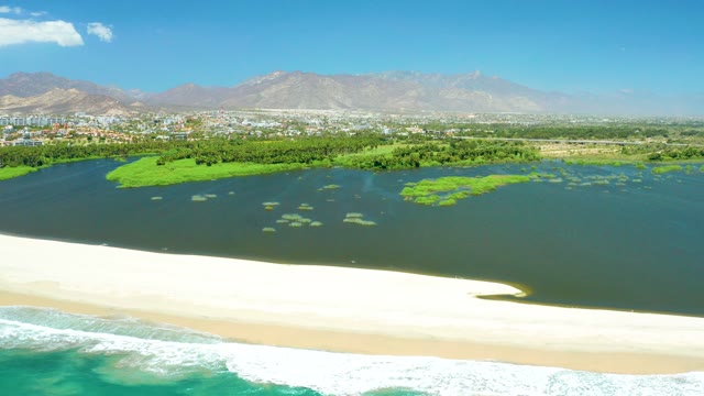 SAN JOSE DEL CABO ESTUARY BCS MEXICO-2021: Coastal Lagoon with Sandy Beach and Distant Mountains