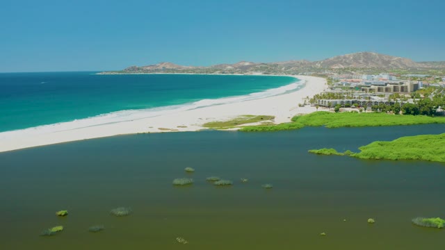 SAN JOSE DEL CABO ESTUARY BCS MEXICO-2021: White Sand Beach and Lagoon with Floating Algae
