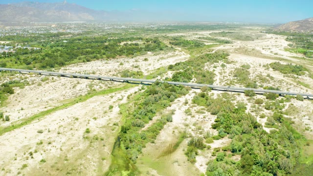 SAN JOSE DEL CABO ESTUARY BCS MEXICO-2021: Highway Through Arid and Lush Terrain