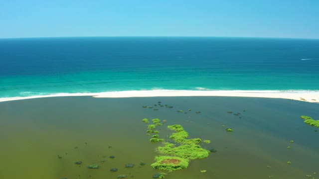 SAN JOSE DEL CABO ESTUARY BCS MEXICO-2021: Wetland Islets and Ocean Waves at Sandy Shore