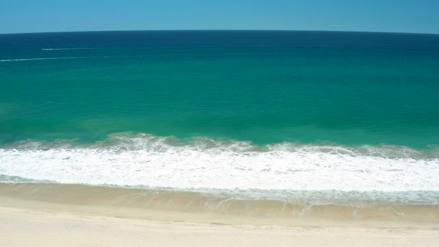 SAN JOSE DEL CABO ESTUARY BCS MEXICO-2021: Waves Rolling Onto Sandy Shore