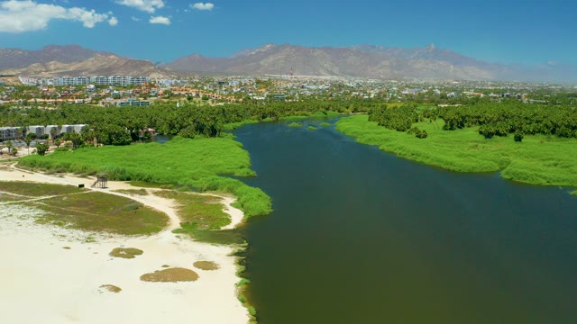 SAN JOSE DEL CABO ESTUARY BCS MEXICO-2021: River Flowing Along Sandy Shore and Wetlands