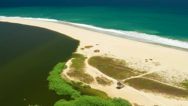 SAN JOSE DEL CABO ESTUARY BCS MEXICO-2021: Hut Moving Along Sandy Beach and Lagoon